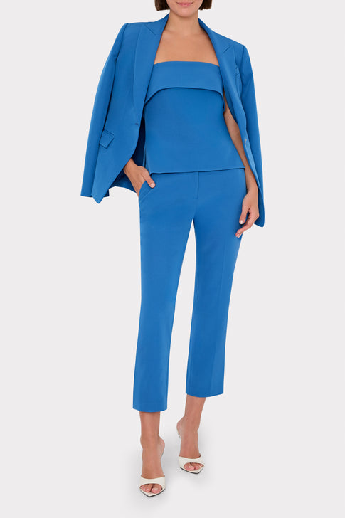 Model wearing classic blue designer suit with strapless top and blazer | MILLY