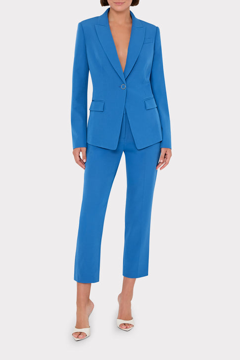 Blue suit worn by a model on a white background