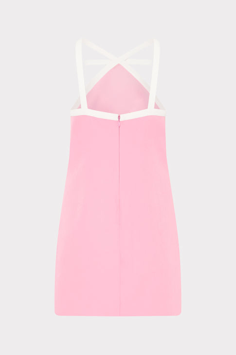 Pink dress with thin straps on a light gray background