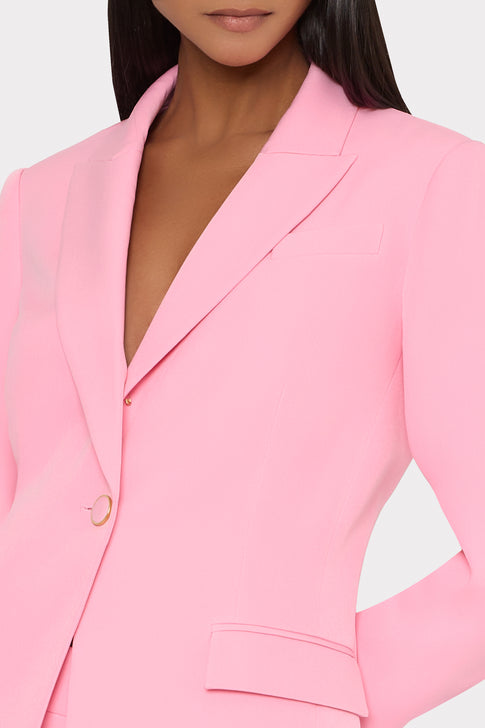 Pink blazer on a light gray background