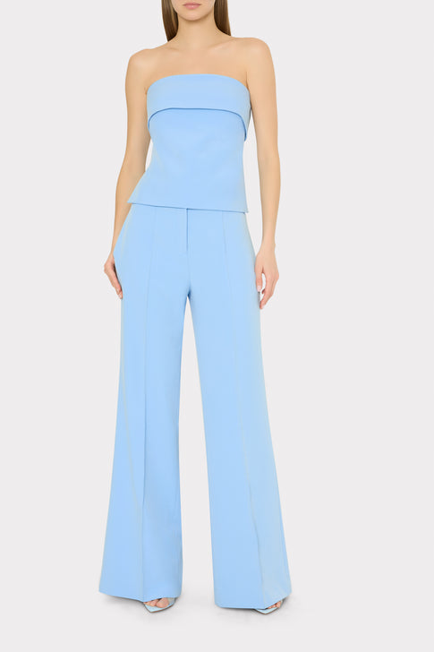 Light blue strapless jumpsuit worn by a model on a white background