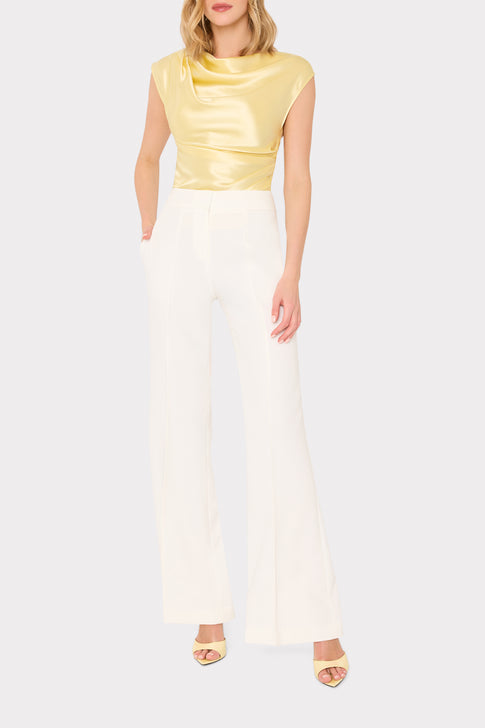 Designer gold satin top with white pants styled look - Front View | MILLY