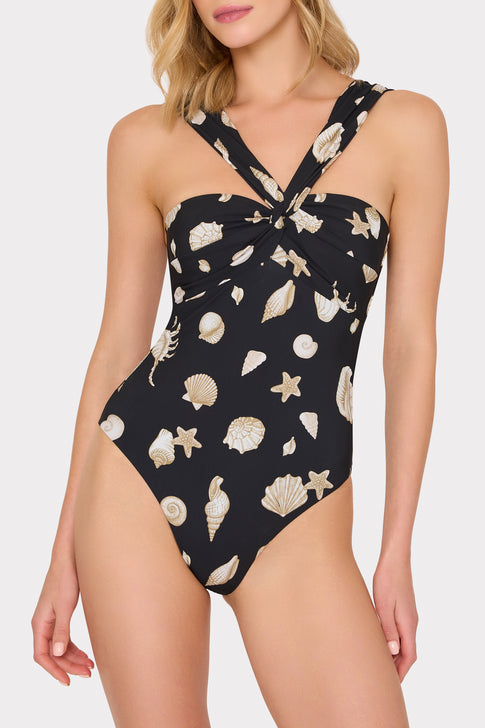 Woman wearing a black one-piece swimsuit with shell pattern - Front View | MILLY