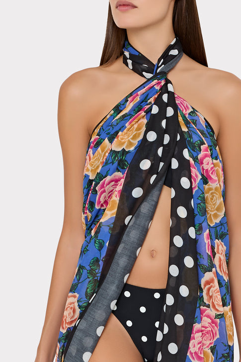 Woman wearing blue floral sarong with polka dot trim as elegant cover-up - Close-up Detail | MILLY