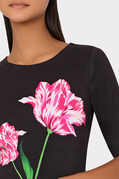 Model wearing Designer Midi Dress with Pink Tulip Detail - Close-up Floral Placement | MILLY