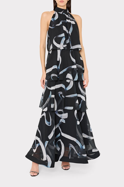 Woman wearing a black dress with abstract white and gray patterns on a white background