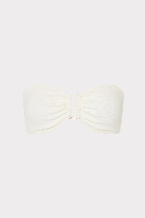 White bandeau top on a light beige background