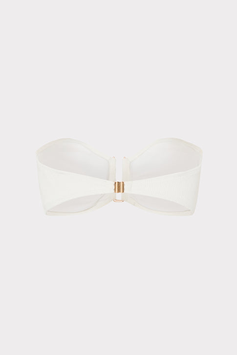 White bandeau top with a gold clasp on a light gray background