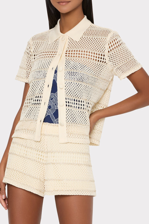 Model wearing cream crochet button-up with navy swimsuit - Resort Look | MILLY