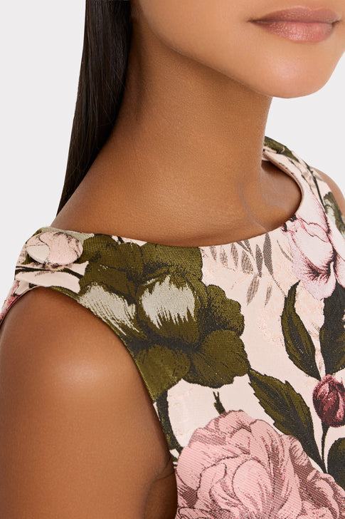 mini multi-colored floral dress on plain background.