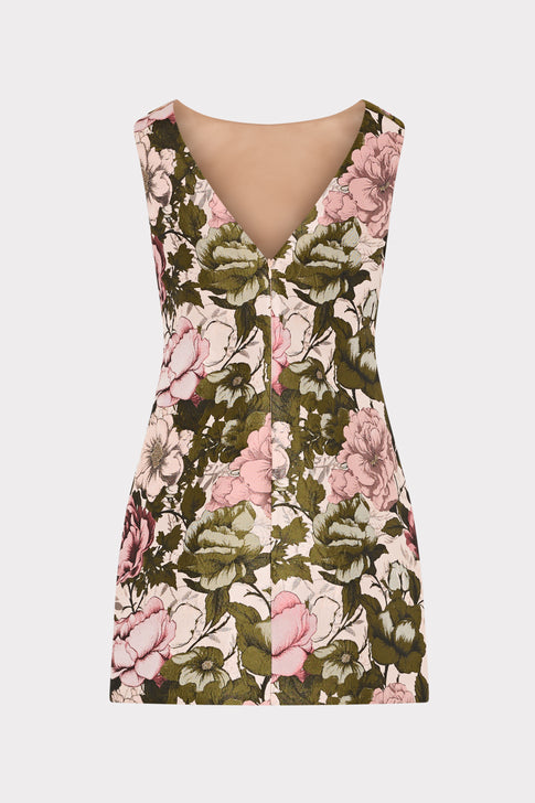 back of mini multi-colored floral dress on plain background.
