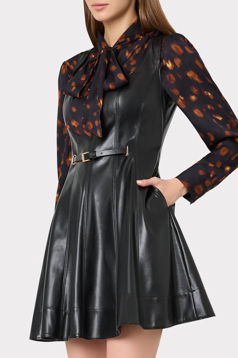 Black Vegan Leather Mini Dress - On Model Side View, Styled with Print Blouse | MILLY