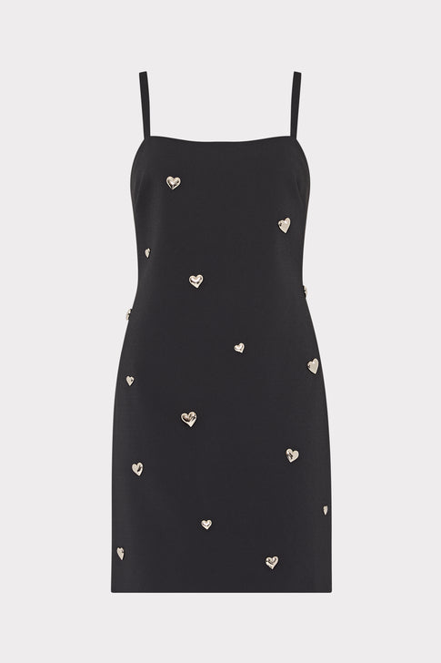 Black dress with heart patterns on a light gray background