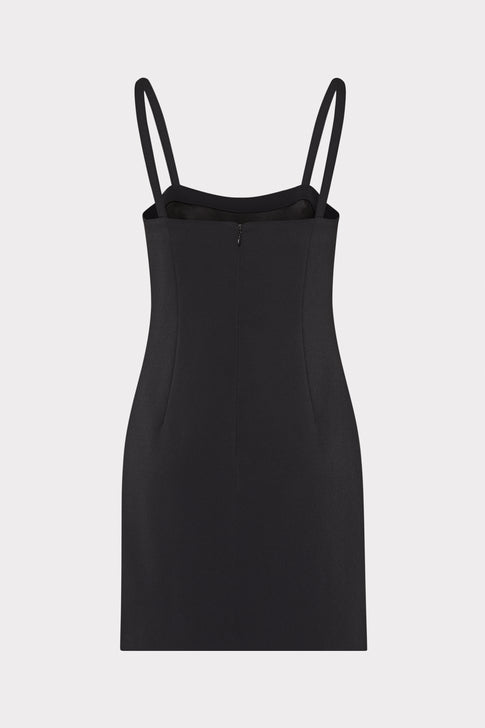 Black slip dress with thin straps on a light gray background