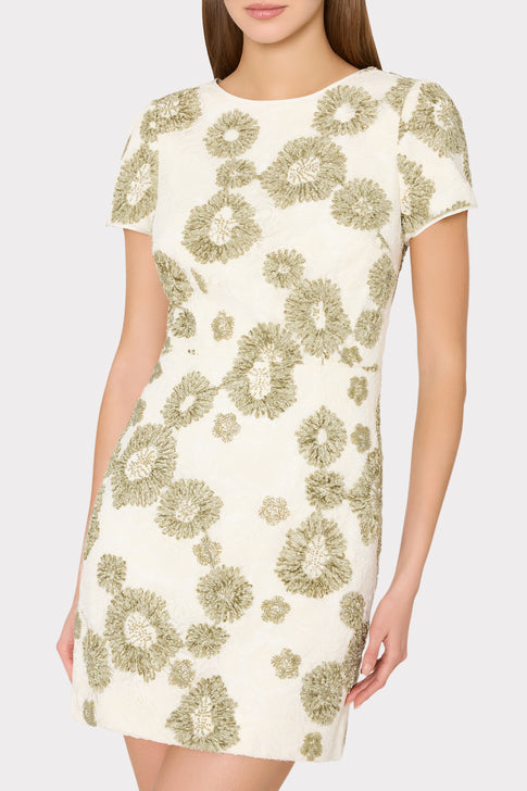 Close-up of unique sage green textured daisy embroidery on white Daisy Mini Dress, cap sleeve detail - Cropped Front View | MILLY