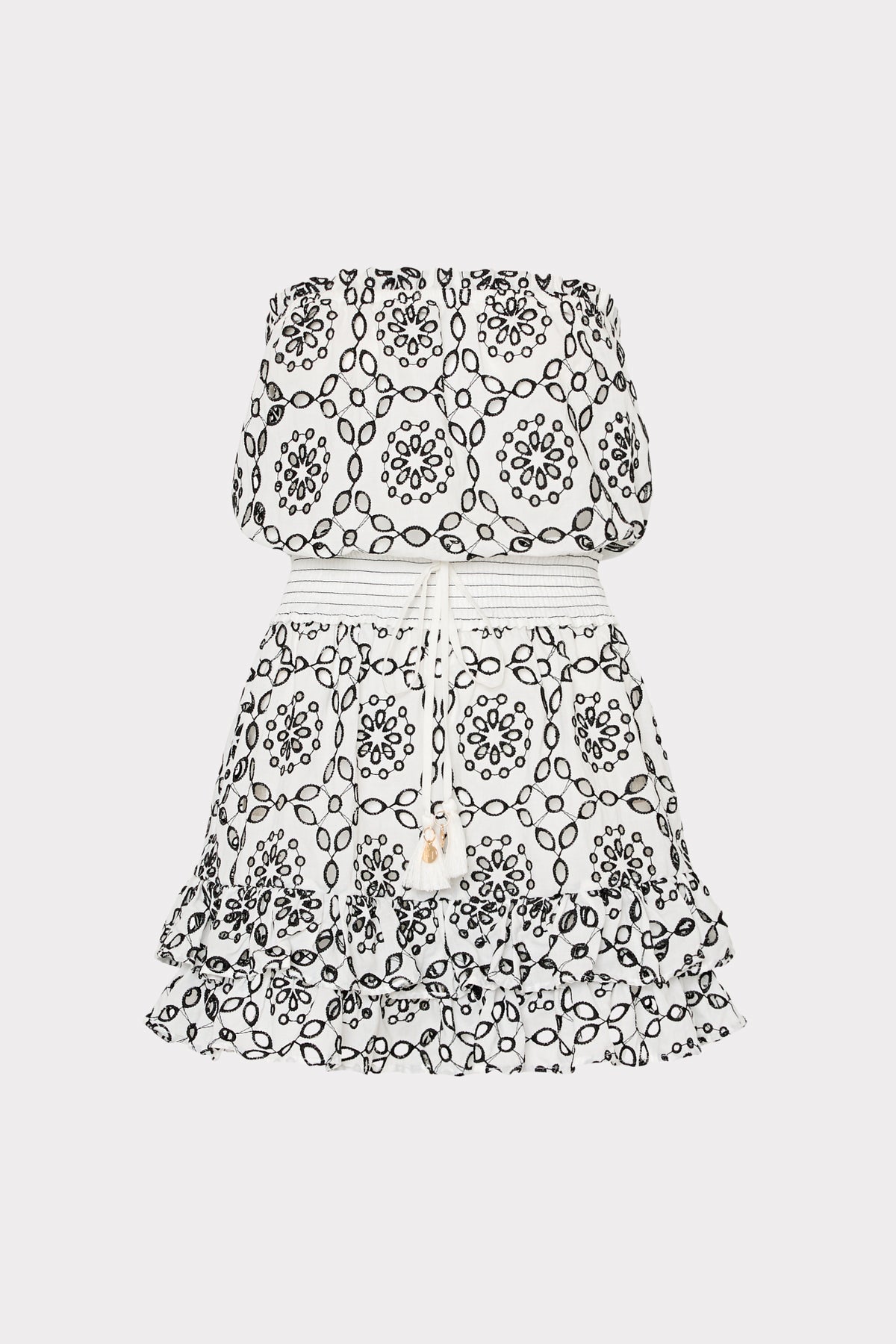 Strapless romper featuring black floral pattern on white background