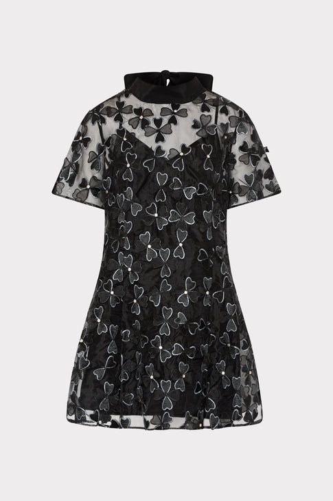 Black dress with butterfly pattern on a white background