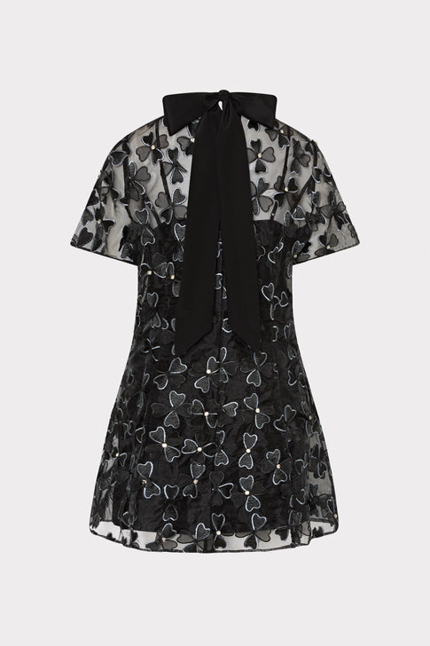 Black dress with butterfly pattern on a white background