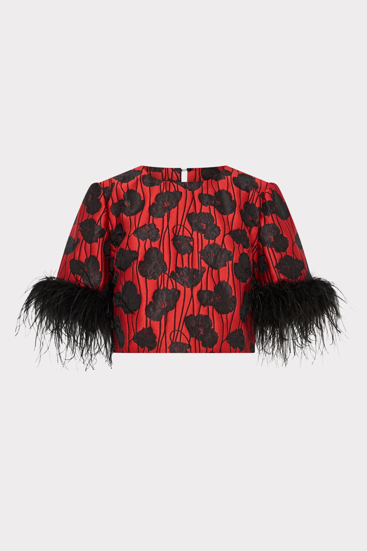 Red top with black floral pattern and feathered sleeves on a white background
