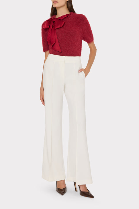 Burgundy Fuzzy Bow Sweater On Model with White Wide-Leg Trousers - Front View | MILLY