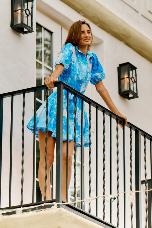 Blue Floral Juni Poplin Dress - Lifestyle On Model Balcony | MILLY