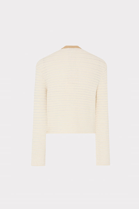 Cream-colored sweater on a mannequin against a white background